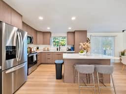Modern Kent 3BR/2BA Retreat | Kitchen & Laundry - Image 2